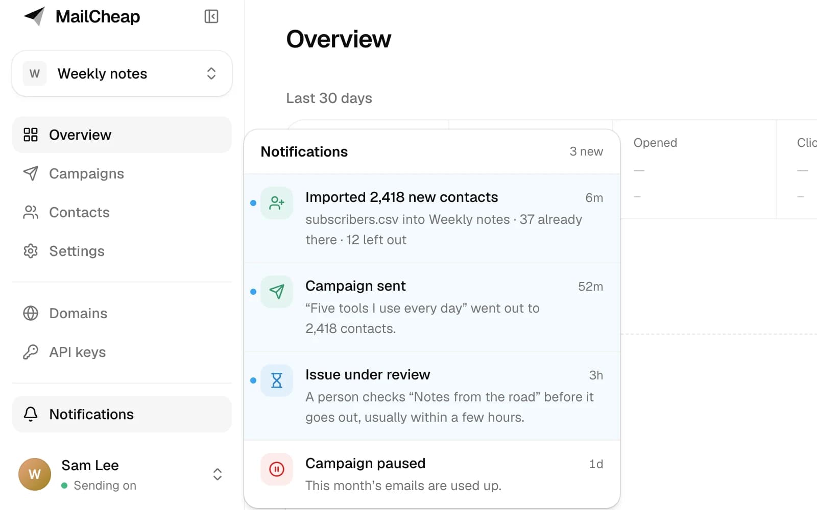 The notifications open beside the sidebar's Notifications section: an import, a sent campaign and an issue under review marked new, above a paused campaign.